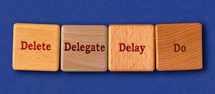 Four wood blocks on a blue background that say Delete, Delegate, Delay, Do