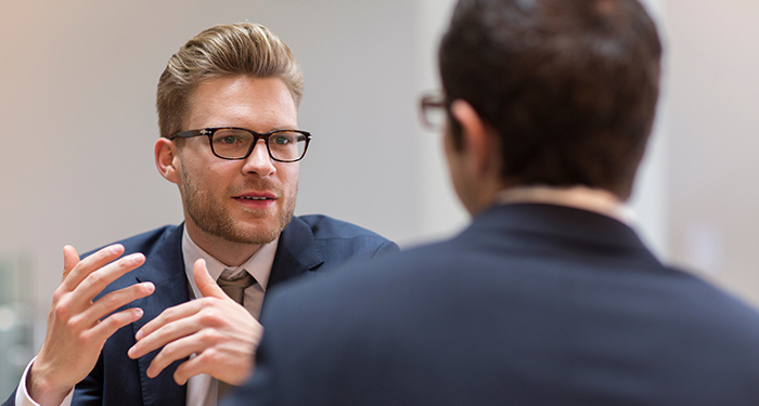 Two businessmen in an interviewing discussion